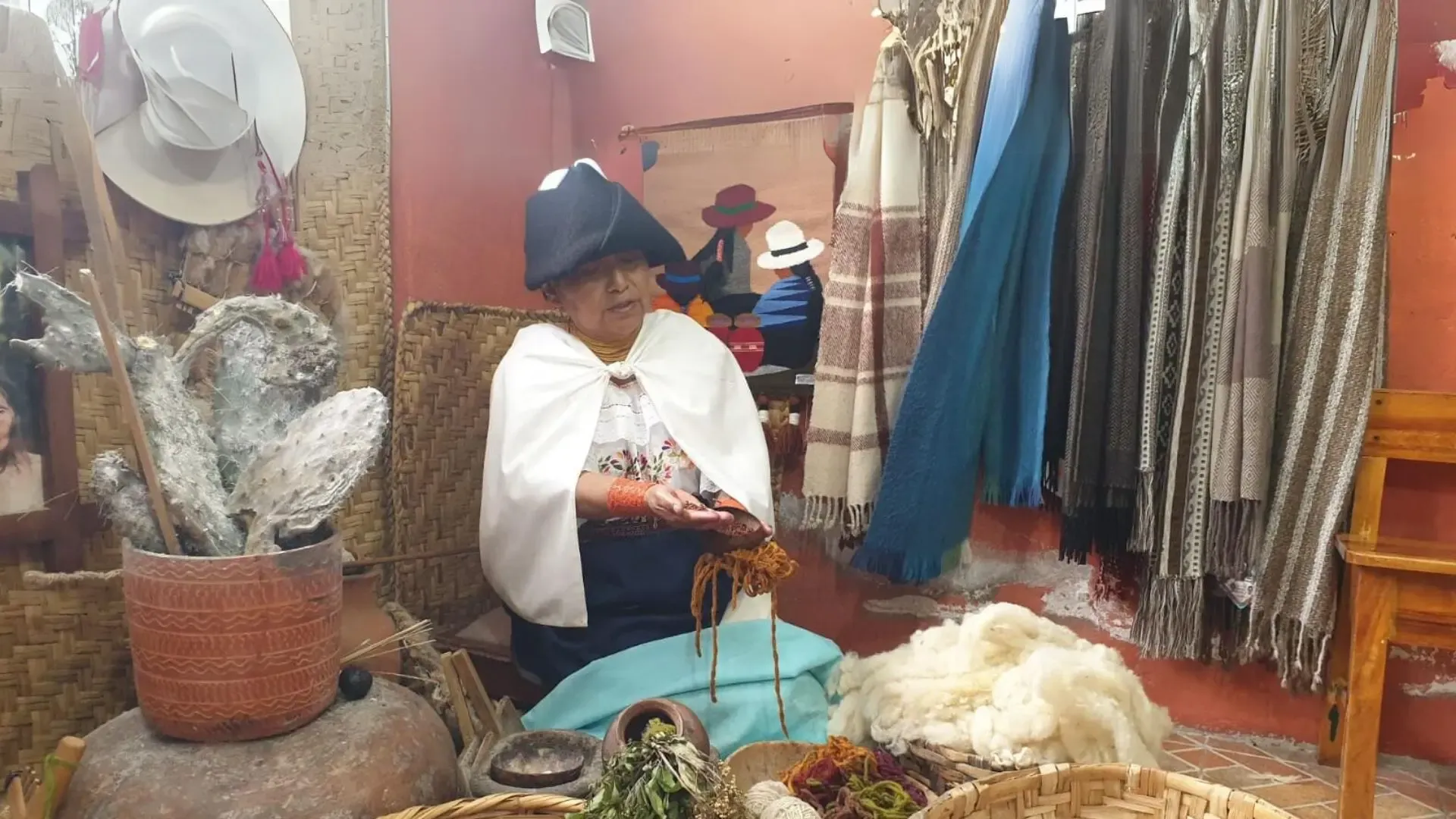 Colorful indigenous textiles and crafts in the Otavalo market, Ecuador